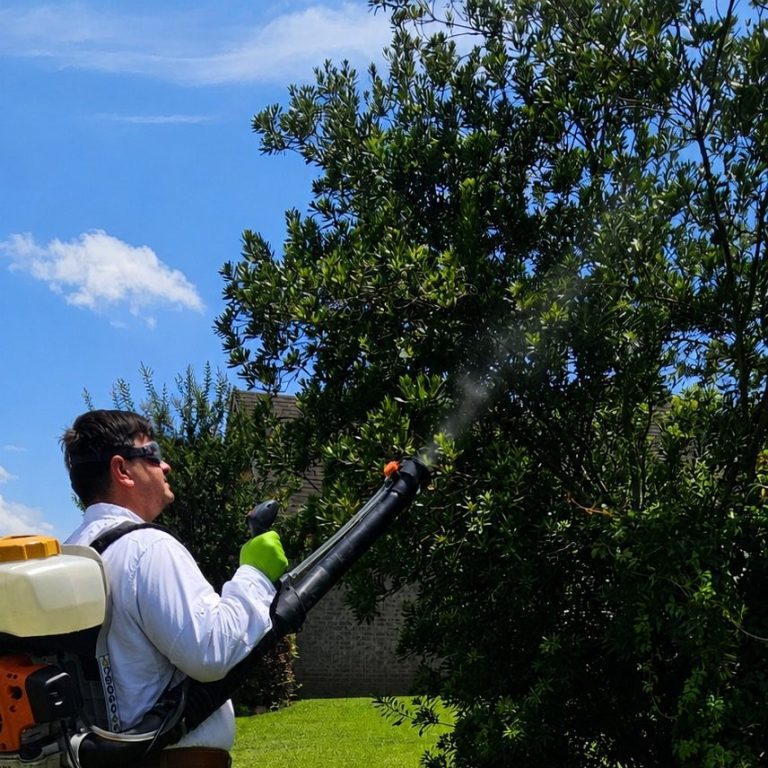 Professional Mosquito Treatment Application | Hilbun Pest Control Hilbun Pest Control technician performing a professional mosquito fogging treatment around landscaping in Bay Minette, Alabama.