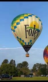 OWA and Foley Alabama Hot Air Balloons | Hilbun Pest Control Foley Alabama hot air balloon during a community event.