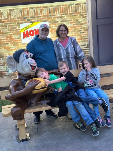 Hilbun Family Visit to Monk's in Wisconsin Dells Noah, Isaac, Sarina, and grandparents Steve and Gail Hilbun posing outside Monk's restaurant in Wisconsin Dells.