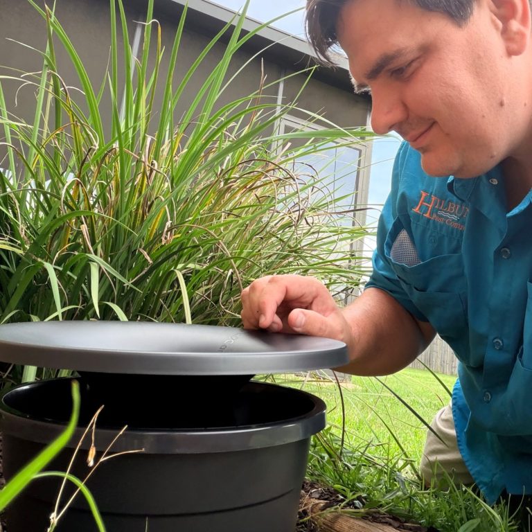 Installing an In2Care Mosquito System | Hilbun Pest Control Hilbun Pest Control technician installing an eco-conscious In2Care mosquito station in Bay Minette, Alabama