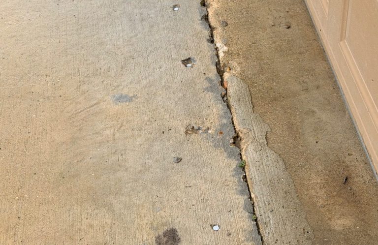 Garage Expansion Joint Termite Treatment Garage slab expansion joint with drilled treatment holes targeting hidden termite entry points