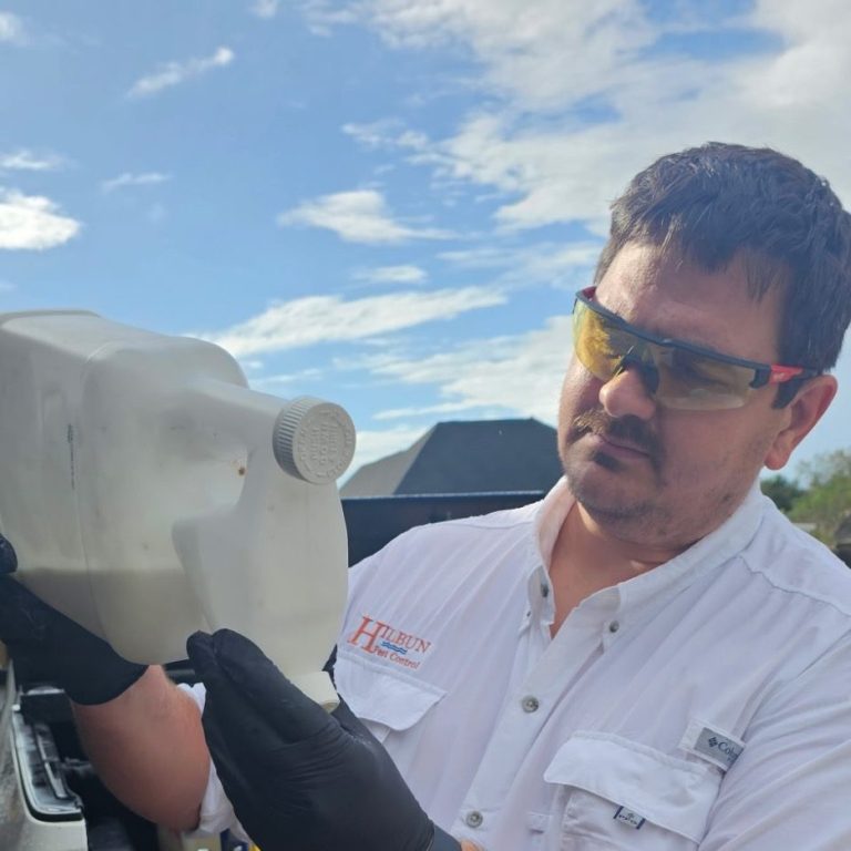 Hilbun Pest Control technician mixing pest control solution for residential treatment in Daphne, Alabama