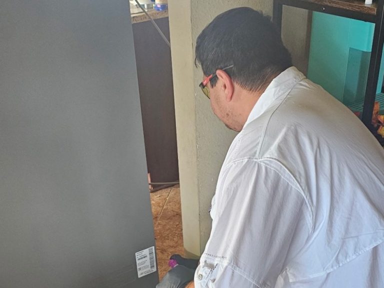 Hilbun Pest Control tech looking for rodent signs in Fairhope home.